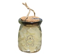 a jar with a teddy bear in it