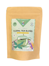 a bag of floral tea blend on a black background